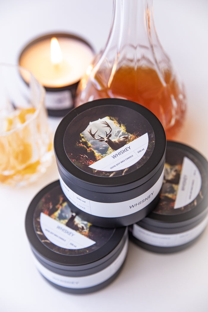 Whiskey soy wax tin candle by Brink of Touch, front view