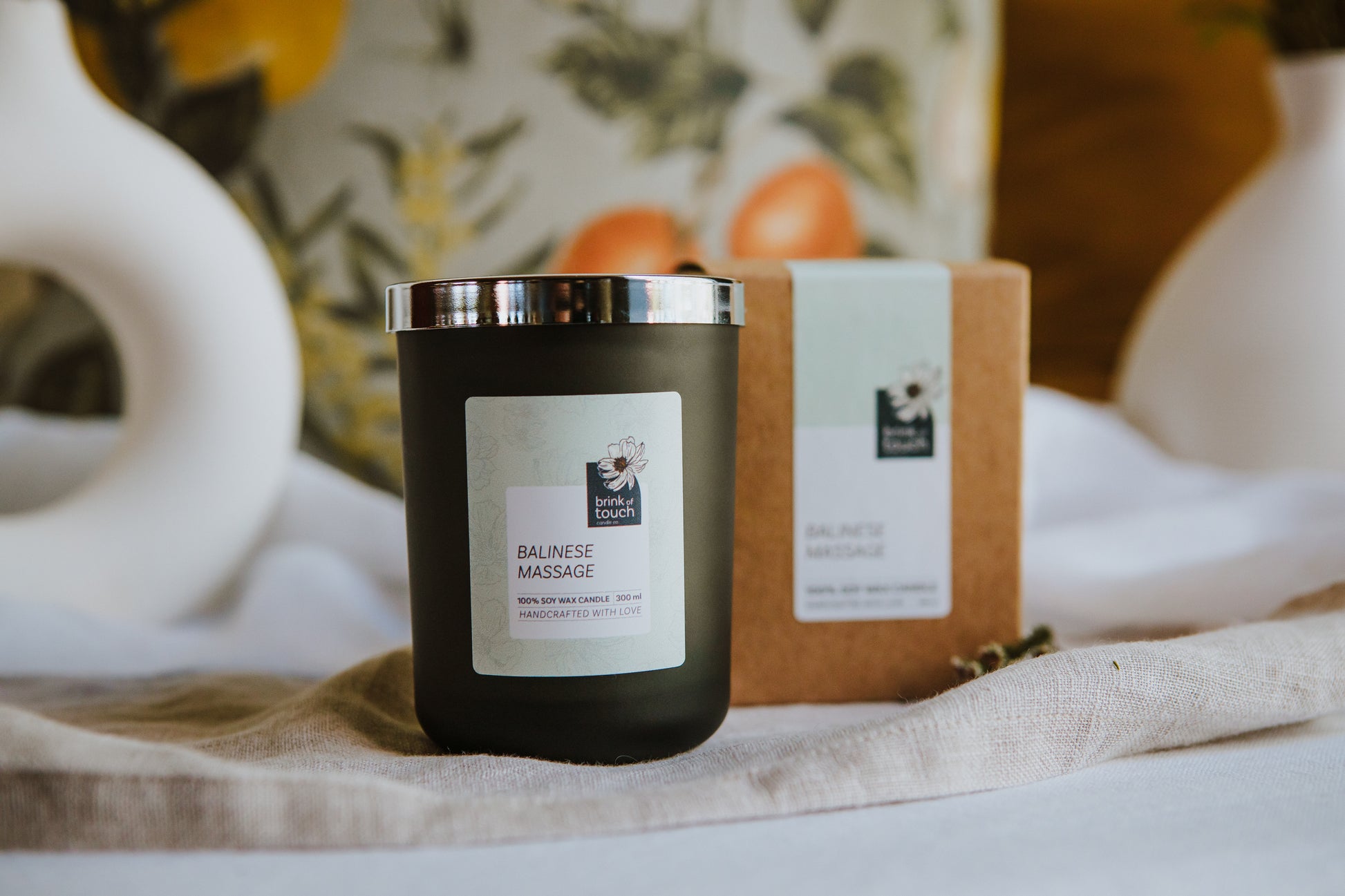 balinese massage candle. A wild tropical blend of fruit, white florals, spice and a hint of musk. a milky bath drawn in a cast iron clawfoot bathtub. a true immersion in the decadence that is a massage on a tropical island.